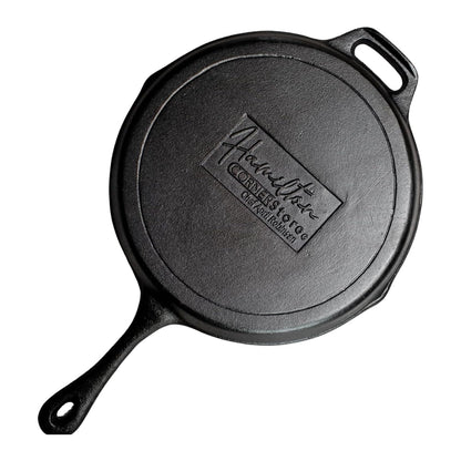 Hamilton Cornerstore Cast Iron Skillet, Pre-Seasoned Cast Iron Skillet with 2 Handles, NEW Signature Embossed Logo Preseasoned Pan, Pour Spouts for Searing, Baking, Grilling, Roasting, (10 inch)